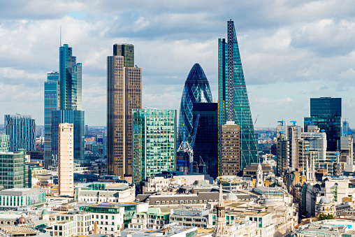 Looking across the rooftops of London towards the skyscrapers of the main financial district.