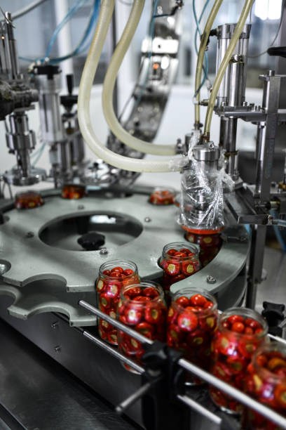 istock Food Plant Using Mechanized Jar Closing Method On Cherry Pepper Filled Jars 1430430474