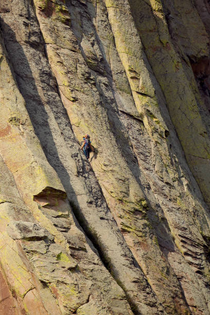 Strong young woman rock climbing in Utah on a beautiful fall day