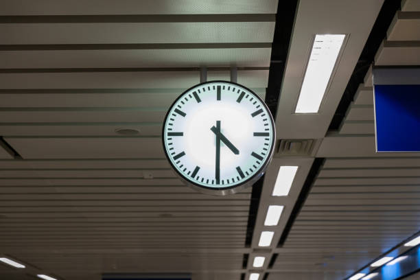Clock at subway station. Large clock face public transport on a train station platform. Analog clock in public metro subway station or metro train platform.