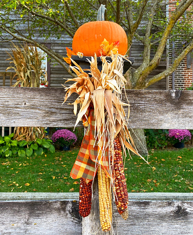 Close up shot of cute halloween harvest scarecrow doll