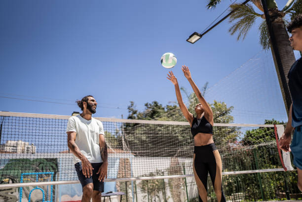 istock Friends playing beach volleyball 1430437928