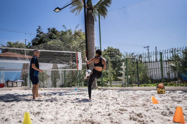 istock Woman training in a sand court 1430438218