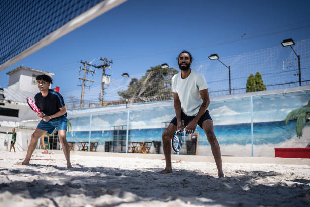 istock Men playing beach tennis 1430442192