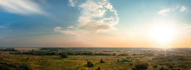 istock Sunset over rural landscape with fields and forest aerial panoramic view 1430442846