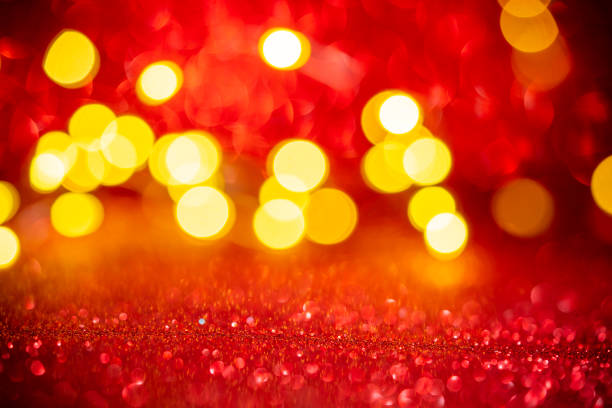 Christmas red glitter background with blurred Christmas lights bokeh card backdrop