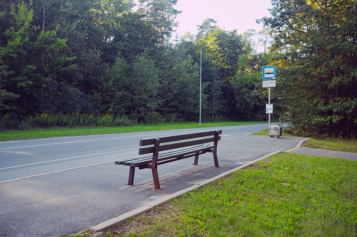 A bench by the roadside reminds of solitude.