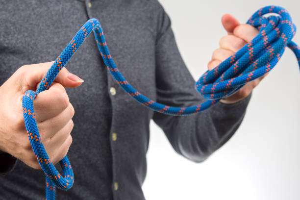 istock hand holds colored rope for climbing equipment. item for camping and climbing 1430462425