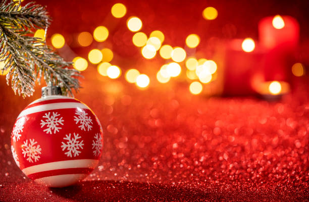 istock Red bauble with snowflakes drawing and Christmas lights on glowi 1430463590