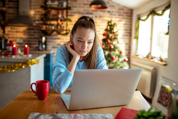 istock Woman using a laptop at home 1430469596