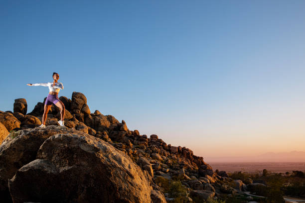 istock Female Fitness outdoors on rocks 1430470529
