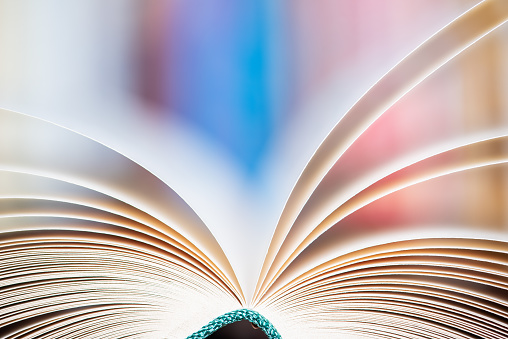 Soft blurred background, close-up of opened book pages
