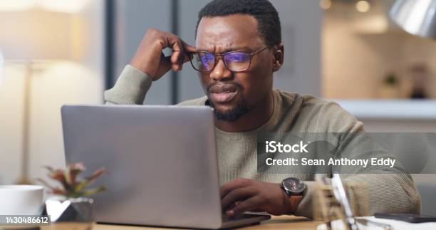 Anxiety Stress And Confused Man On A Laptop In Home Office Worry And Anxious About An Online Project Deadline Glitch 404 And System Error Delay With Black Business Man Working Remote Frustrated Stock Photo - Download Image Now