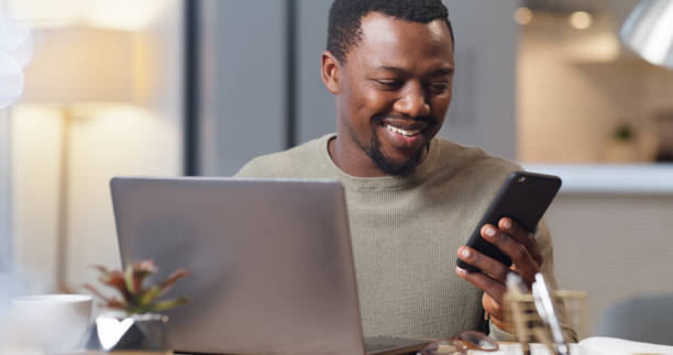 istock Phone, laptop and email with a black man entrepreneur remote working from his home office in a startup. Communication, networking and contact with a business professional at work in his house 1430486624