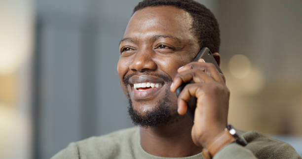 istock Happy black man with phone call for work from home opportunity, loan success or client feedback with house lights bokeh. Excited person with smartphone networking communication for contact us 1430486674