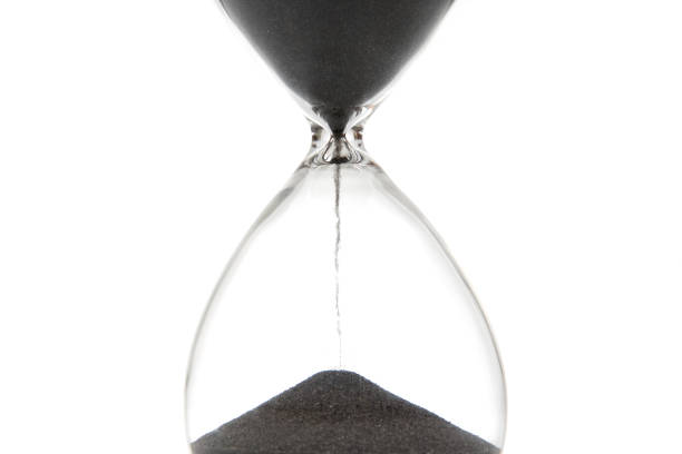 Hourglass on a light background. Time is money. Business solutions in time.
