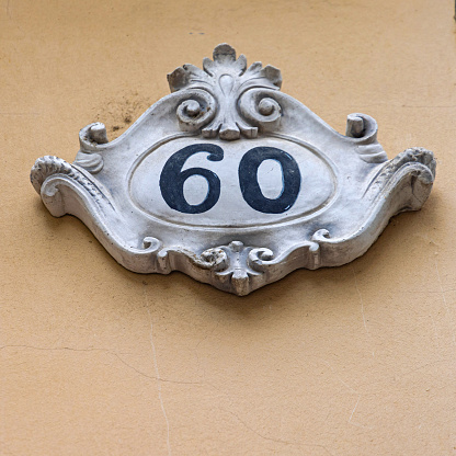 3d Antique Ceramic House Number Sixty at Building Wall