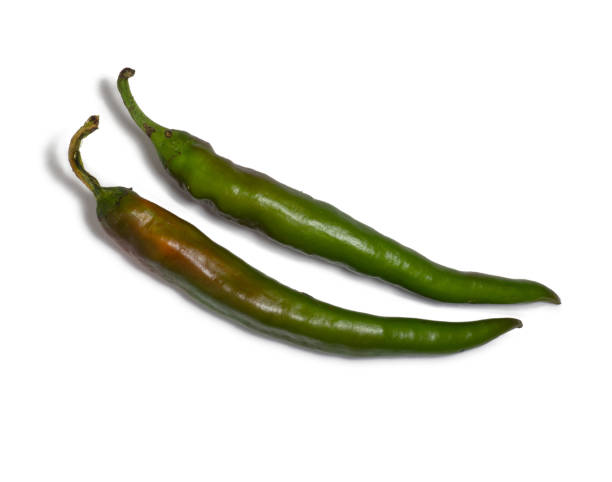 istock Fresh green chili peppers. Spicy vegetable isolate. Peppers on a white background. Ingredient for dishes. The concept of spicy food. Fresh chili pepper. Harvesting vegetables for seasonings. 1430503260