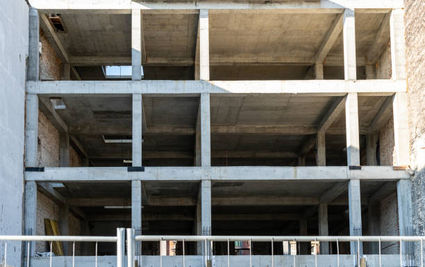 istock Building under construction. Construction site against blue sky. Industrial background 1430509254