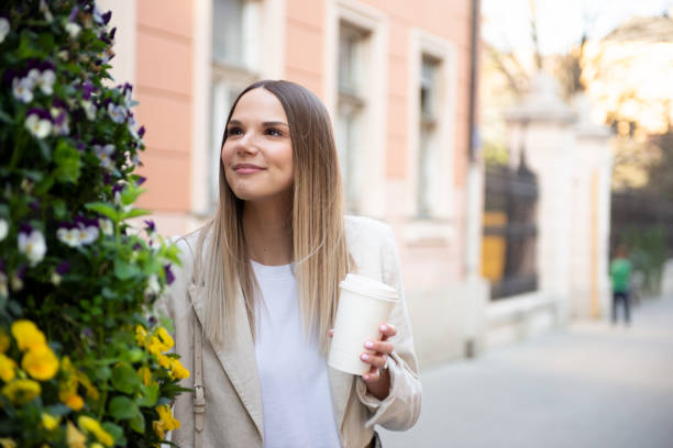 istock Happy young woman on street 1430509448