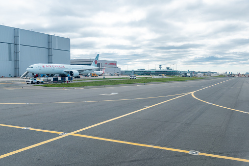 Airplanes are waiting for tourists boarding at Pearson International airport of GTA, Ontario, Canada.