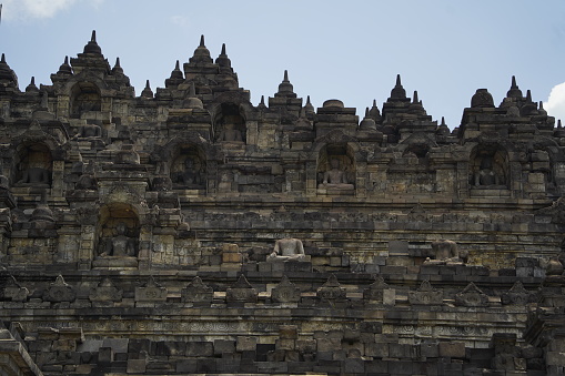 Borobudur Temple, Java, Indonesia. July 01, 2020. Some tourists are climbing the Borobudur Temple during a sunny day. Borobudur is a Mahayana Buddhist temple in Central Java, Indonesia.