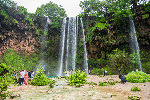 Tourists exploring Iguazu Falls on the border of Brazil and Argentina.