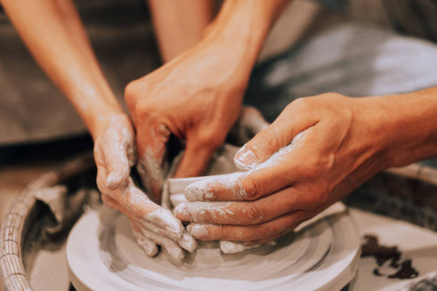 istock Couple mold ceramic vase in a pottery workshop 1430542209