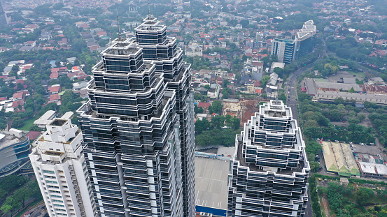 Aerial view of futuristic roofs of skyscrapers. Jakarta cityscape.