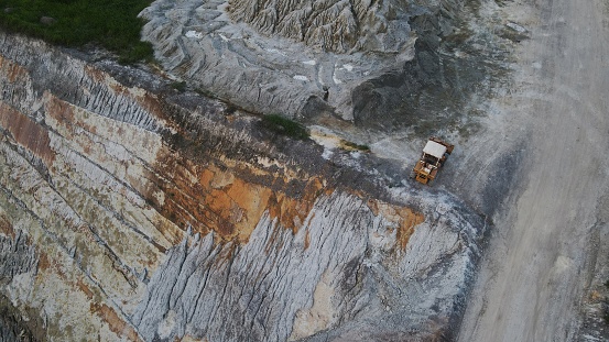 Aerial photography of an abandoned mine in Chiang Mai, the colorful colors of the mine contrast strongly with the surrounding environment.