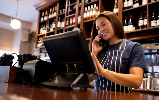istock Waitress working at a pub and talking on the phone 1430548710