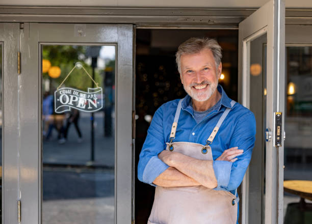 istock Happy business owner smiling at a restaurant 1430548803