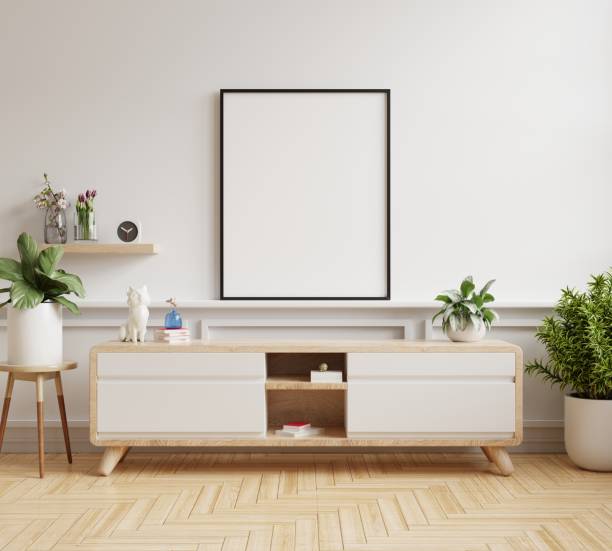 istock Mock up poster frame on cabinet in living room interior. 1430552286