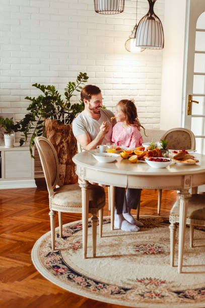 istock Father and daughter having breakfast fun 1430554091