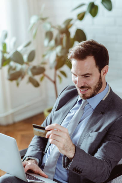 istock Businessman spending money online 1430555613