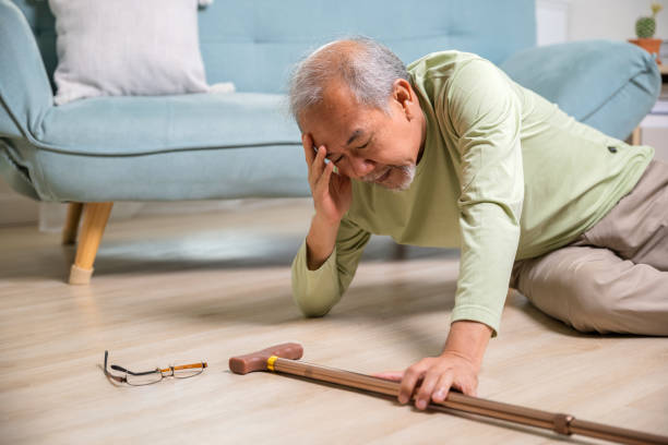 istock Sick senior old man falling down lying on the ground because stumbled at home 1430560535