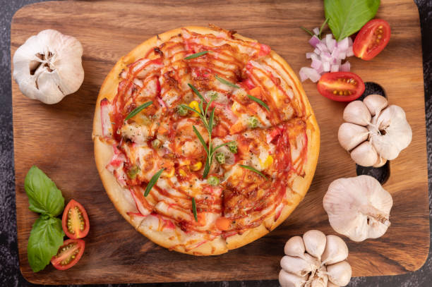 pizza placed on a wooden plate.