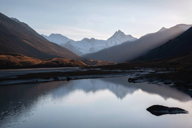 istock mountains glacier lake reflection sunlight autumn 1430562791