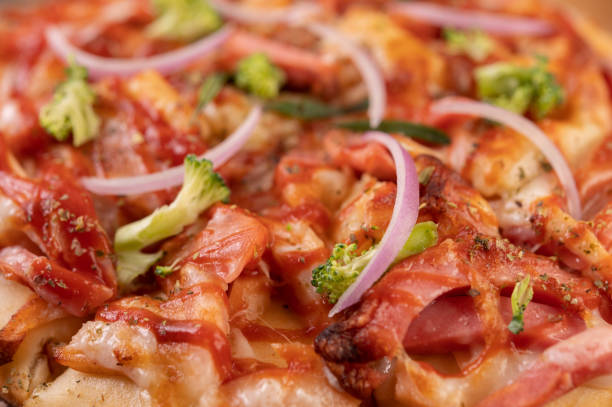istock pizza placed on a wooden plate. 1430563090