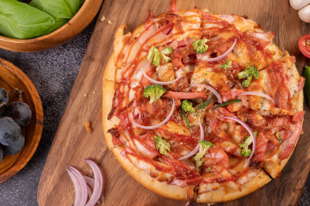 istock pizza placed on a wooden plate. 1430563273