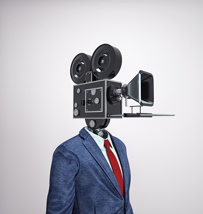 Businessman with a camera instead of head. Journalism and content creator concept. This is a 3d render illustration