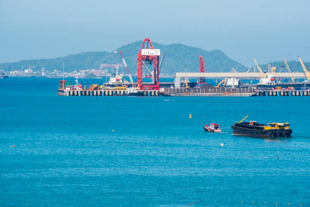 Engineering shipping crane depot at logistic export terminal control. Warehouse freight background container yard loading quayside harbor port. Logistics seascape shipping portal concept