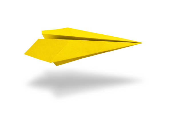 Yellow paper plane origami isolated on a blank white background