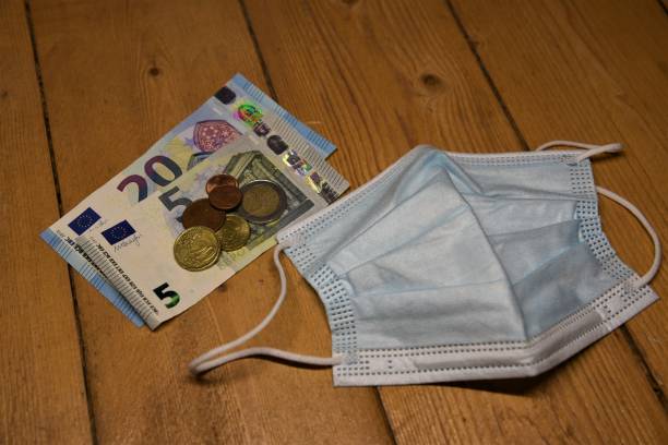 istock euro notes and coins and a mask 1430572785