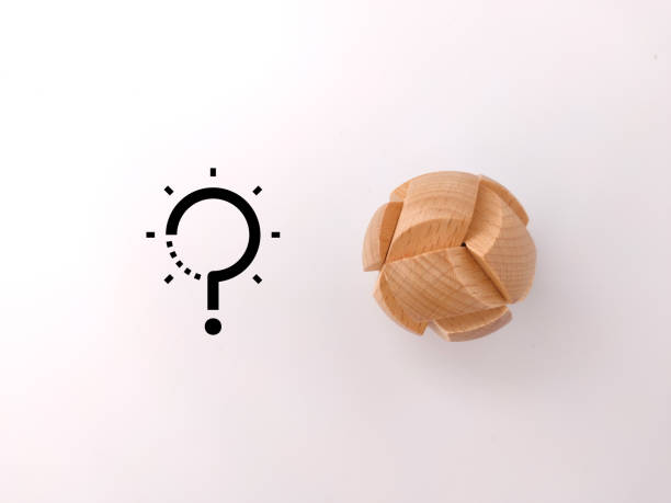 istock Wooden toy puzzle with solution icons on a white background. Innovation concept. 1430575760