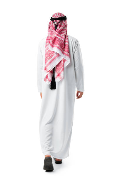 istock Back view of an Arab man standing on white isolated background 1430577255
