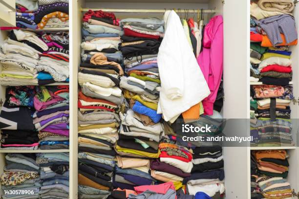 Messy Wardrobe With Different Clothes Fast Fashion And Shopper Concept Stock Photo - Download Image Now