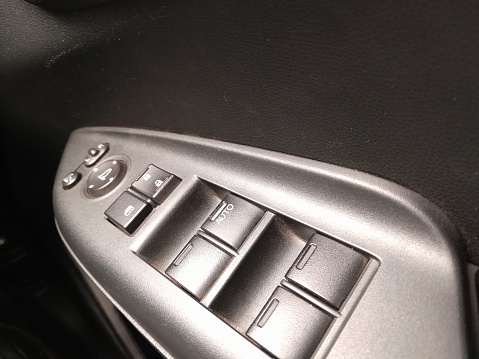 photo of buttons, control panel to set and control car windows and doors