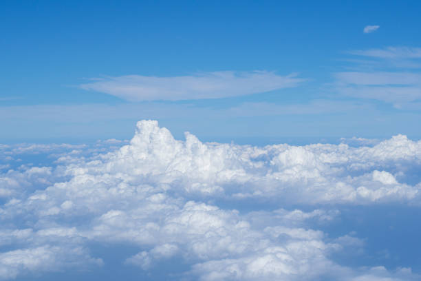 istock Aerial view of cloudscape seen through the airplane window 1430582055