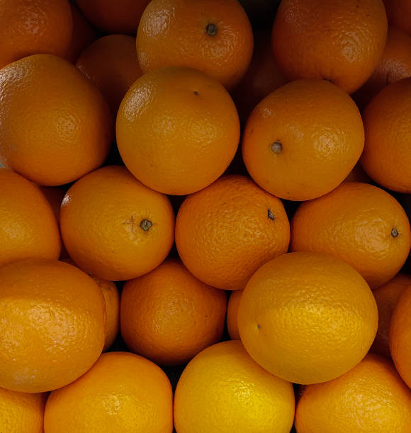 istock Pile of oranges in a fresh fruit shopping mall 1430582249